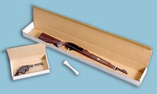 firearms strapped into cardboard boxes